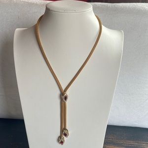 Vintage gold plated Y necklace with red and clear crystal dangle pendants.